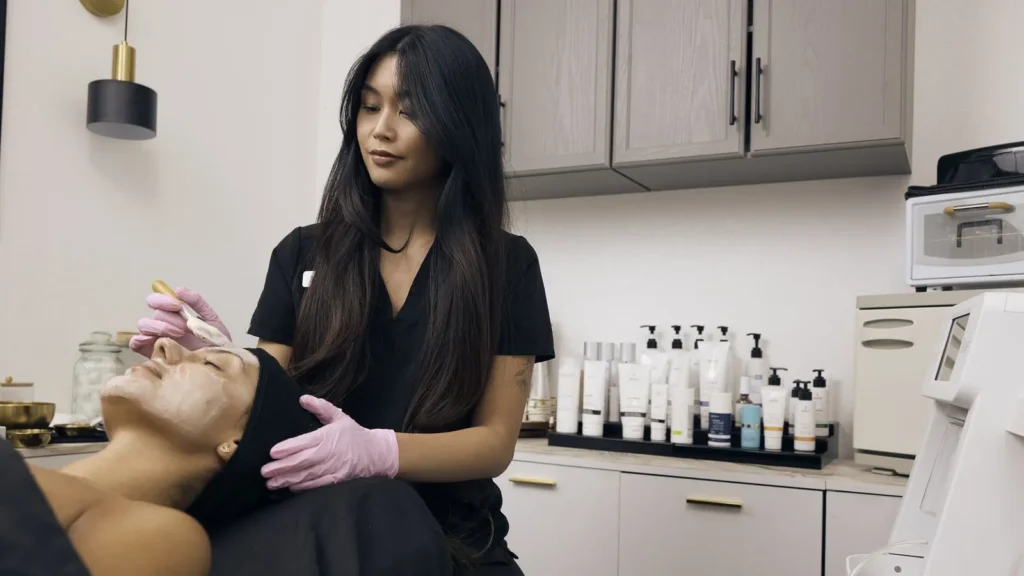 Esthetician performing a skin treatment at Spoiled Aesthetics in Las Vegas